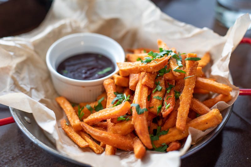 Crispy french fries served in a paper cone